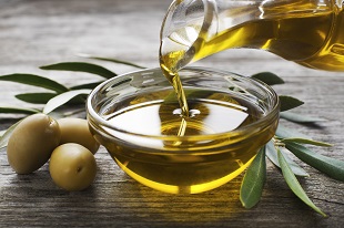 lifespa image olive oil and olives pouring glass bowl